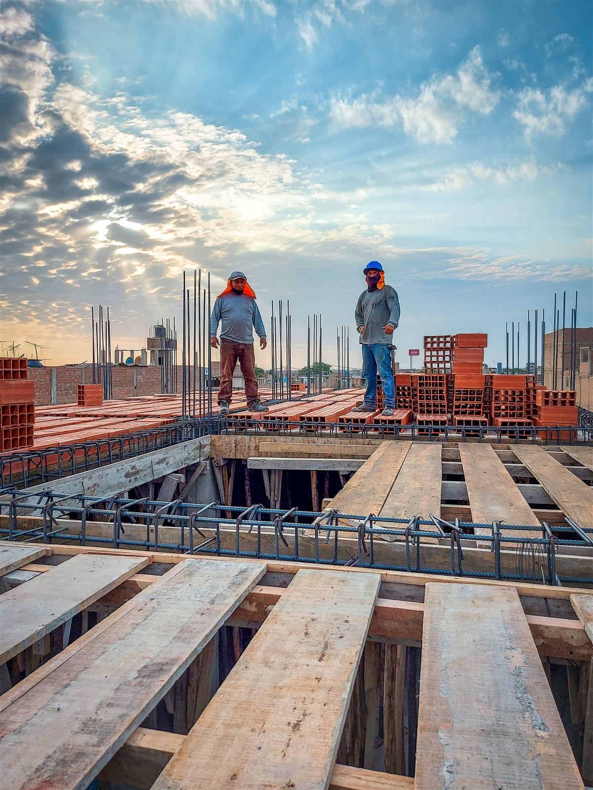 Two workers on a concrete slab